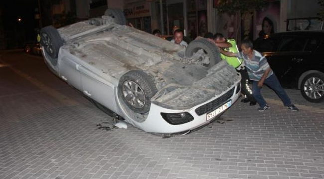 Takla atan otomobilden yara almadan kurtuldu