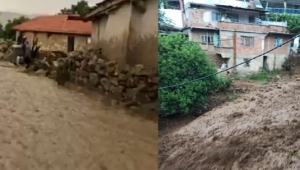 Şiddetli yağış köydeki yolları dereye çevirdi